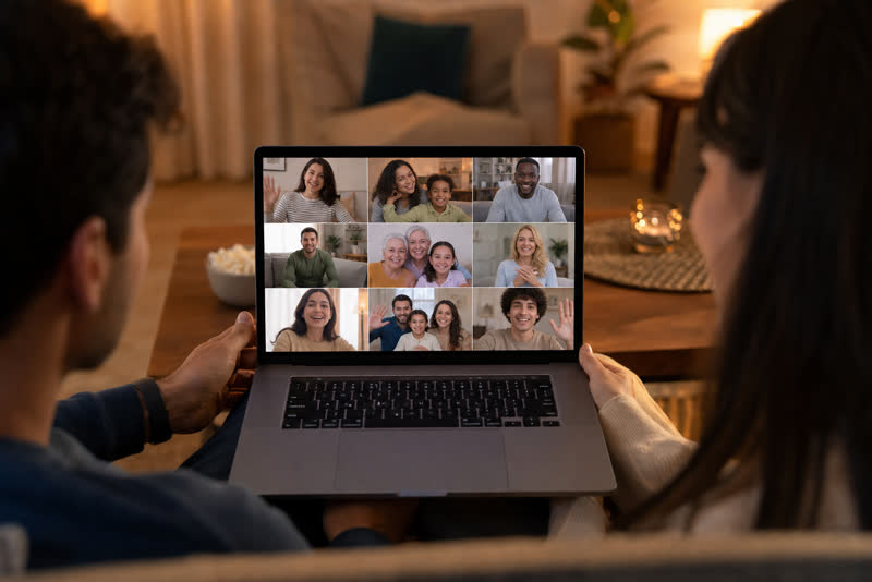 Family video montage playing on a laptop as an anniversary surprise gift
